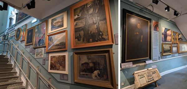 photos of artworks displayed on a staircase